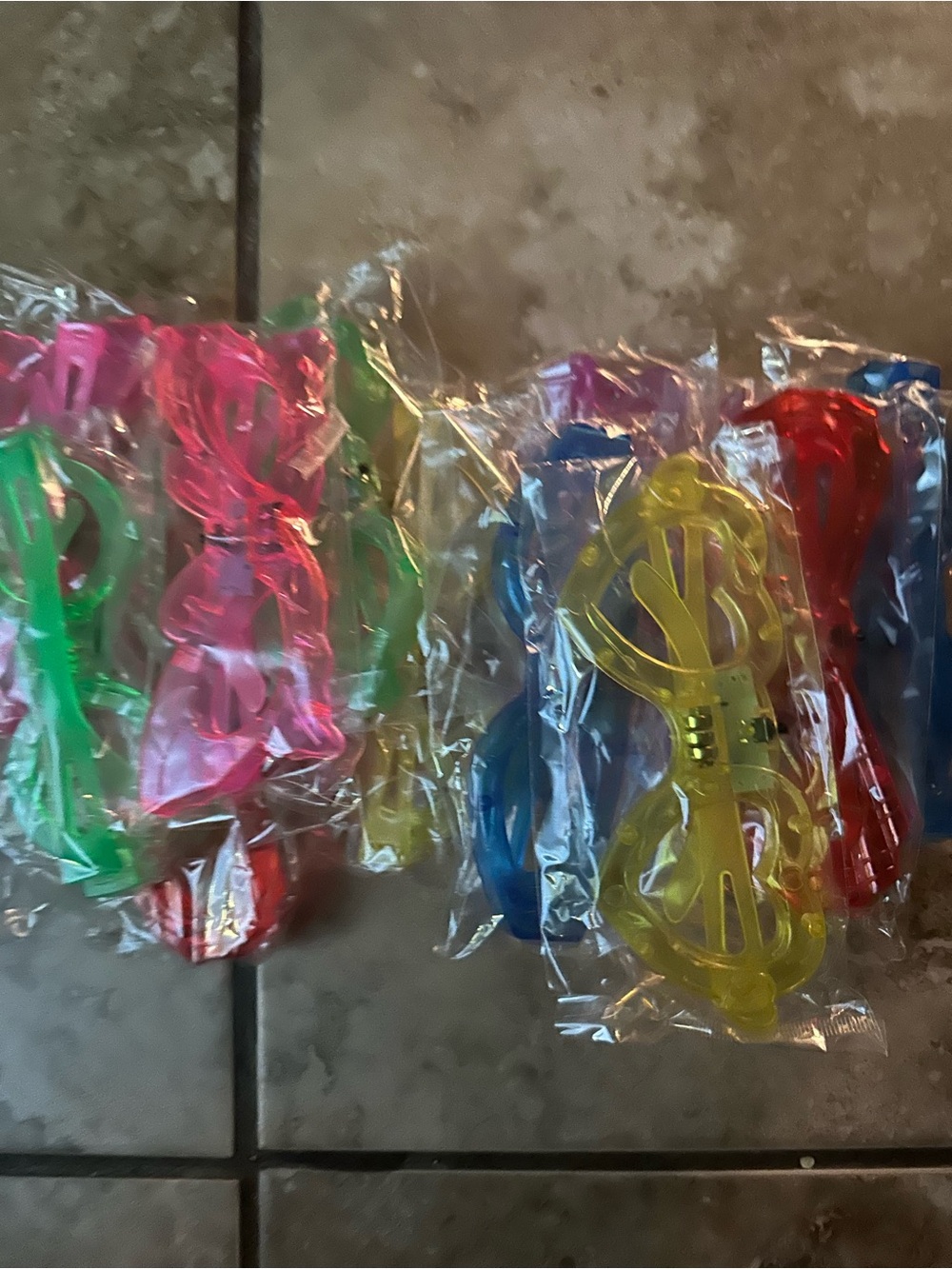Kids Light-Up Novelty Sunglasses Pack - Assorted Colors.  They are four packs